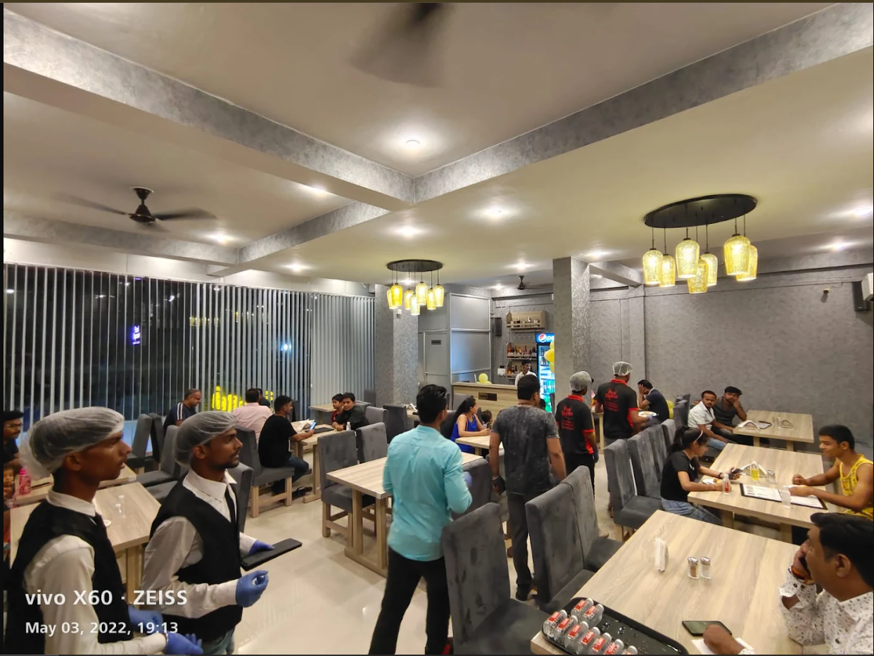 Clean, modern dining area interior of Food Express restaurant in Dudhi